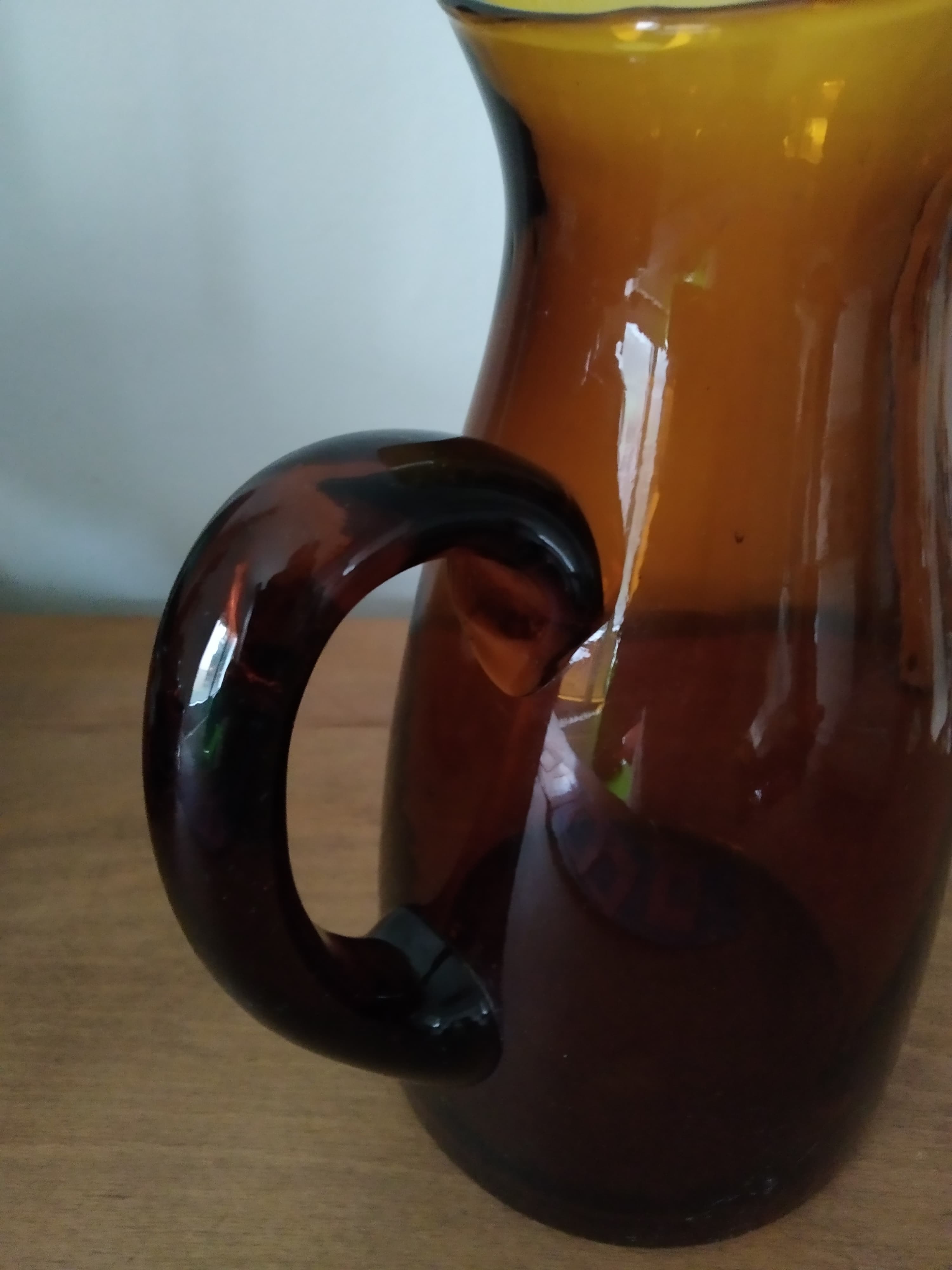 Vintage pitcher in amber glass