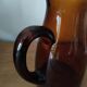 Vintage pitcher in amber glass