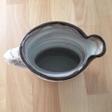 Signed ceramic pitcher. Glazed part. Worked cove