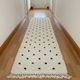 Berber hallway rug with black dots in wool