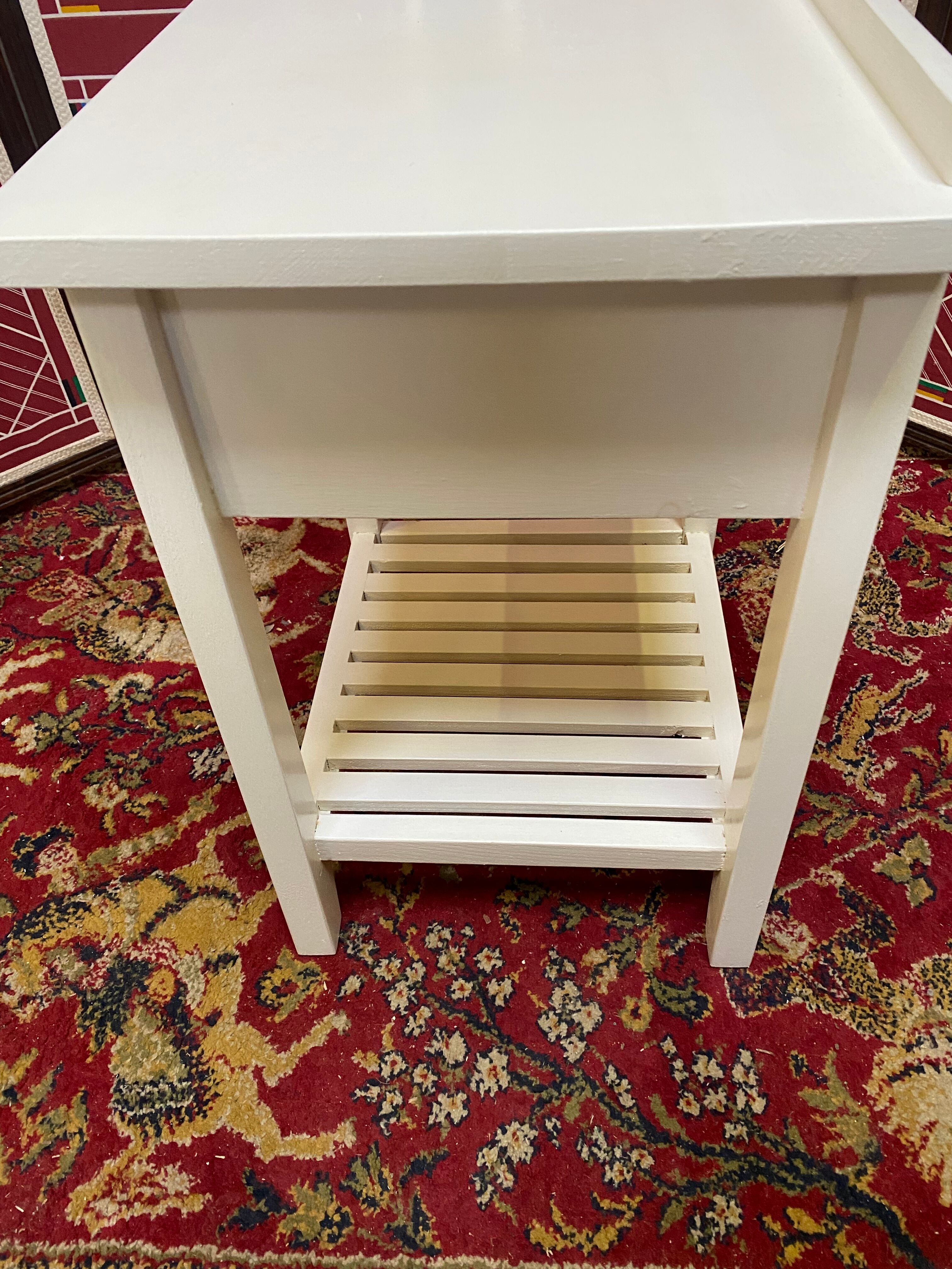 Wooden bedside table painted white