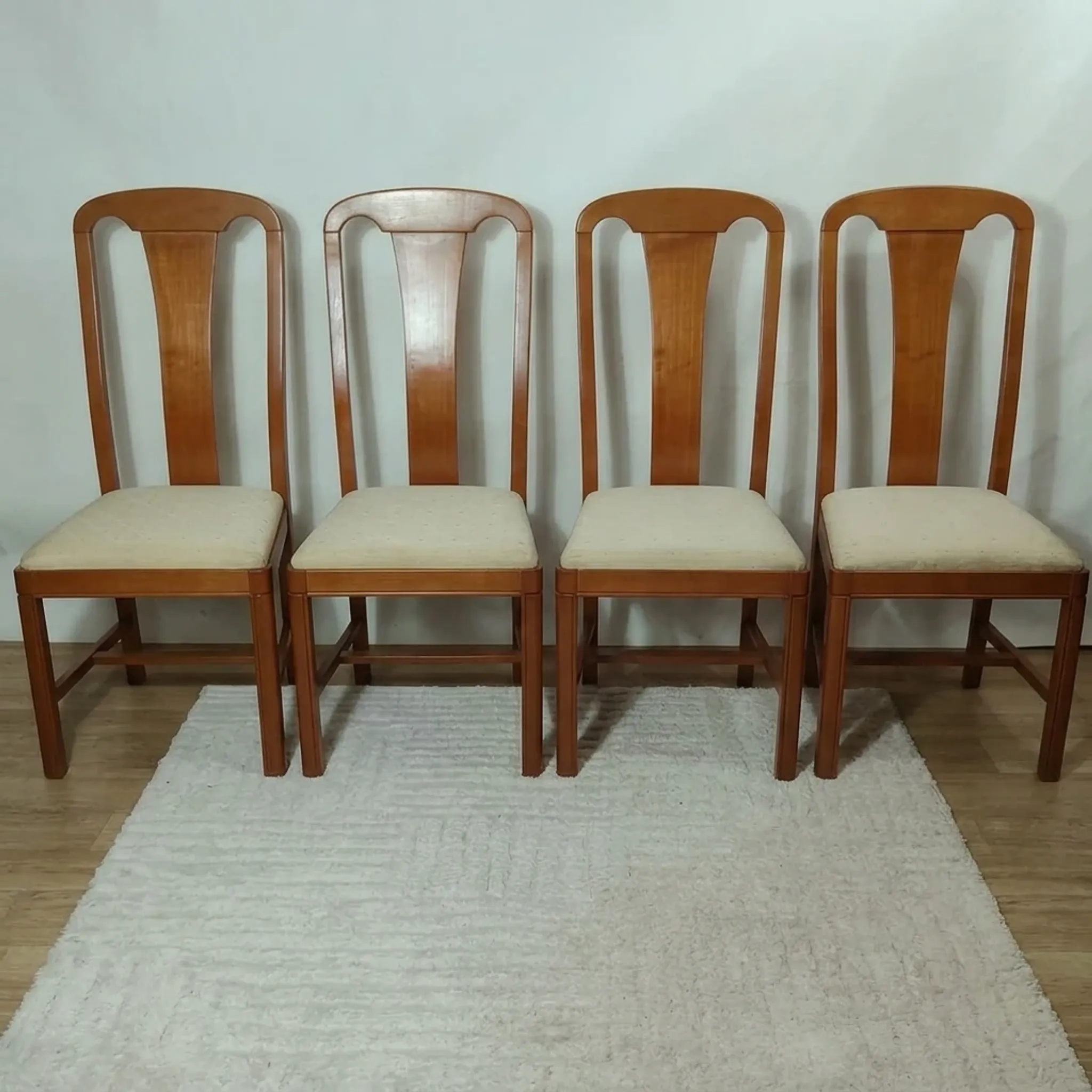 Set of 4 vintage chairs in stained wood and cream fabric.