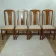 Set of 4 vintage chairs in stained wood and cream fabric.