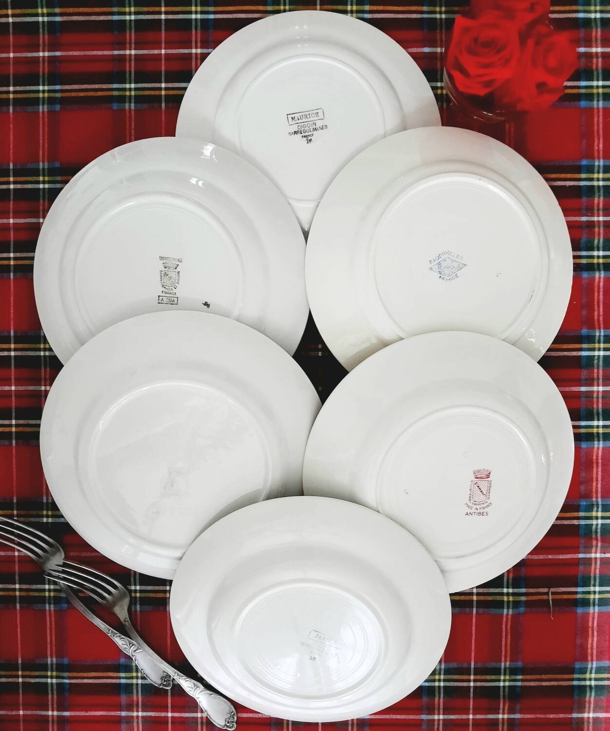 Mismatched antique flat plates in earthenware accompanied by a deep dish.
