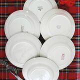 Old mismatched earthenware dinner plates accompanied by a deep dish