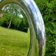Round mirror of the 70s chromed by Reggiani Lampadari