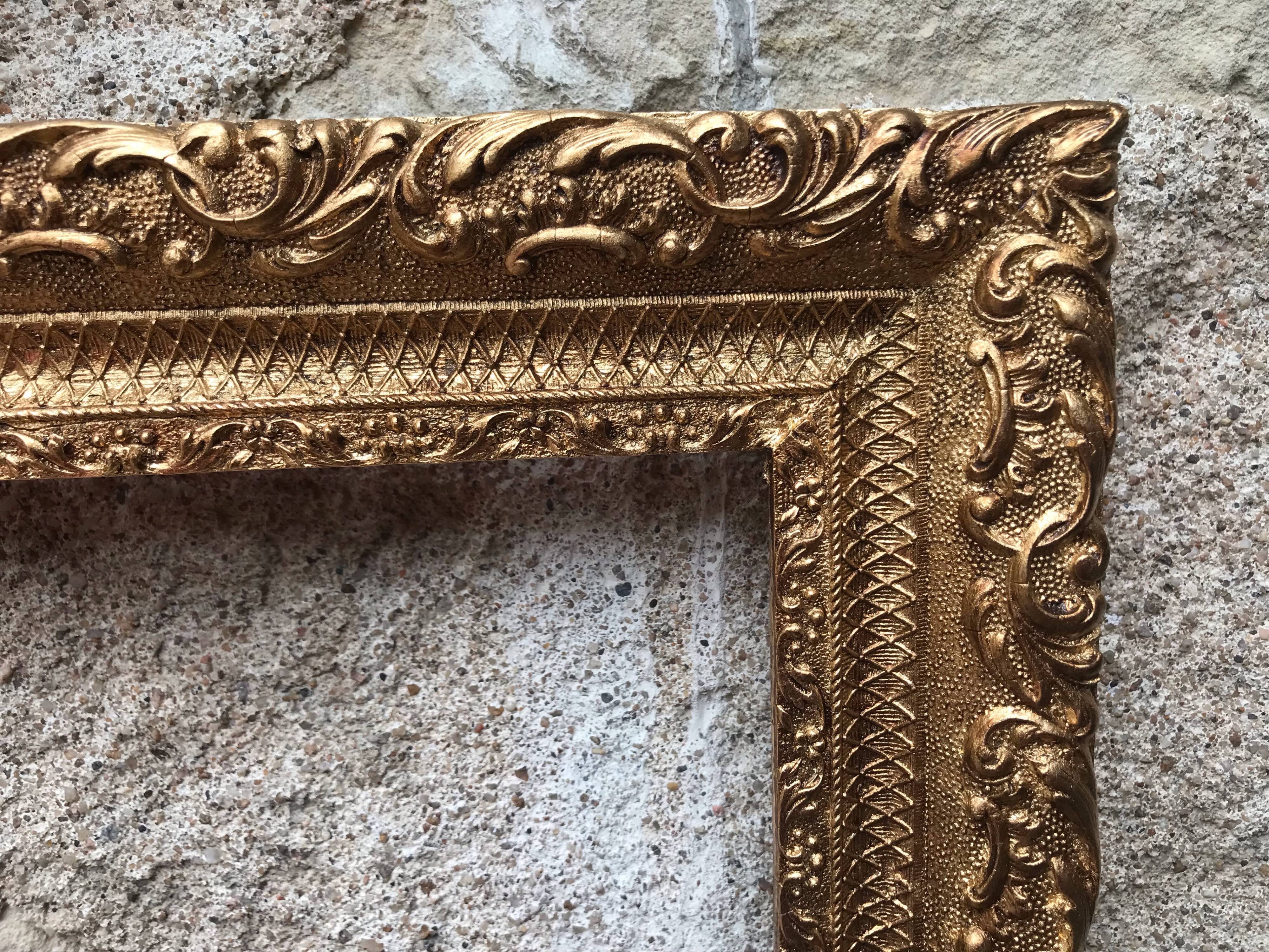 Old gilded frame with leaf