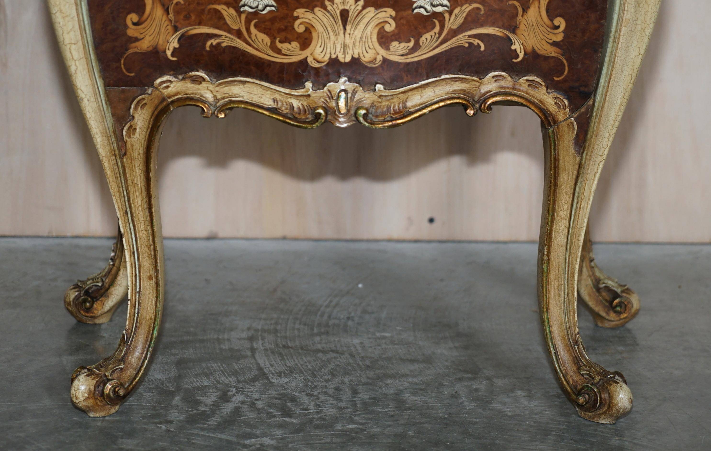 Pair of curved walnut commodes with marquetry and marble tops.