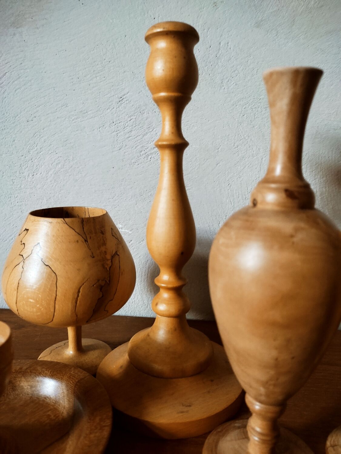 Composition of vases and cups in turned wood