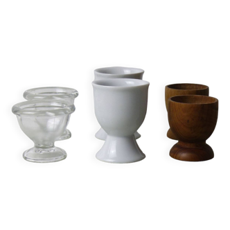 Set of 6 mismatched egg cups in wood, glass and porcelain