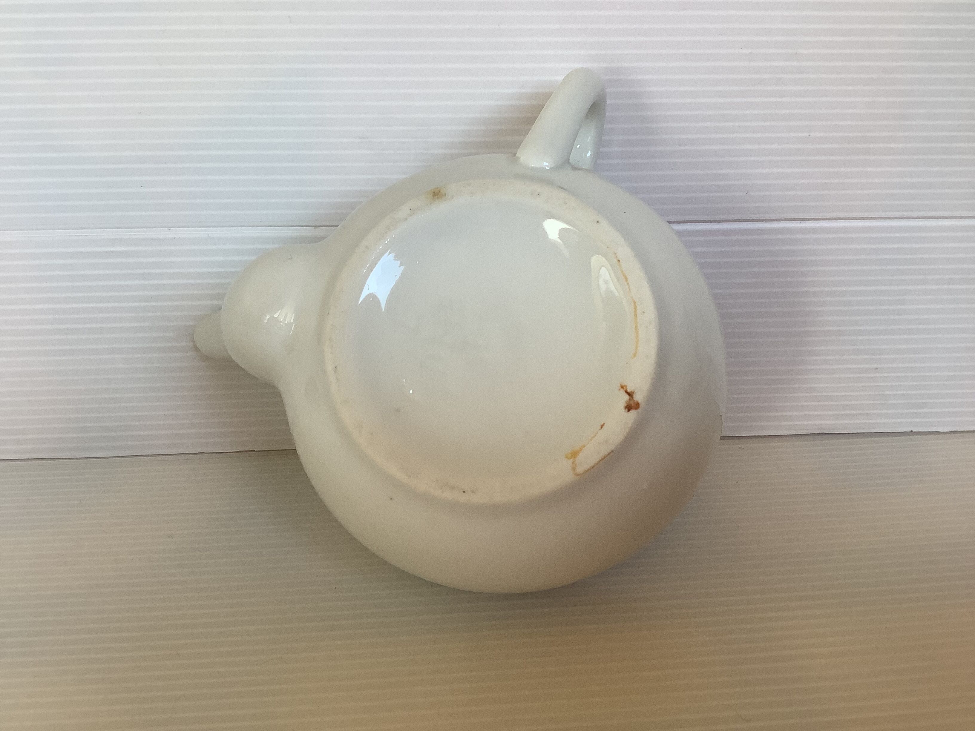 Old baby bottle sauceboat