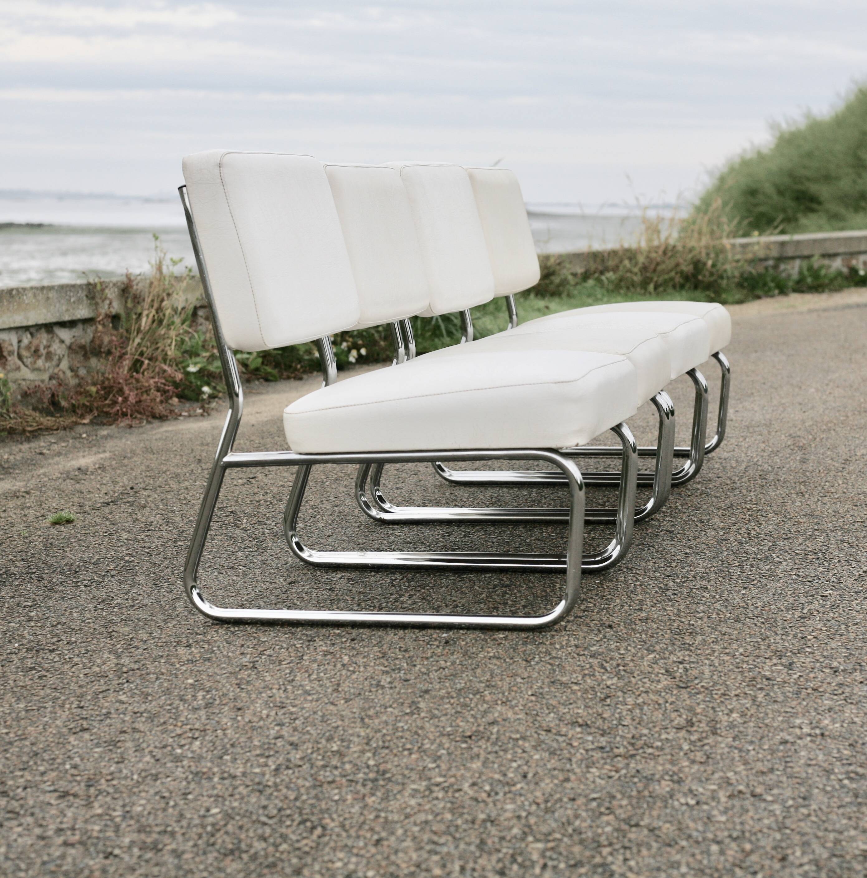 4 armchairs forming a modular sofa. Steel, imitation leather, 70s