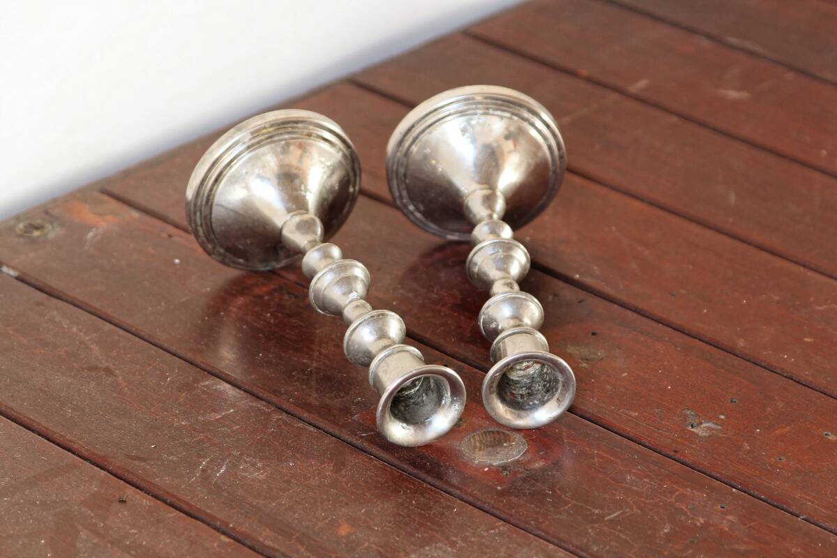Pair of silver metal candlesticks