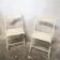 Pair of white wooden folding chairs