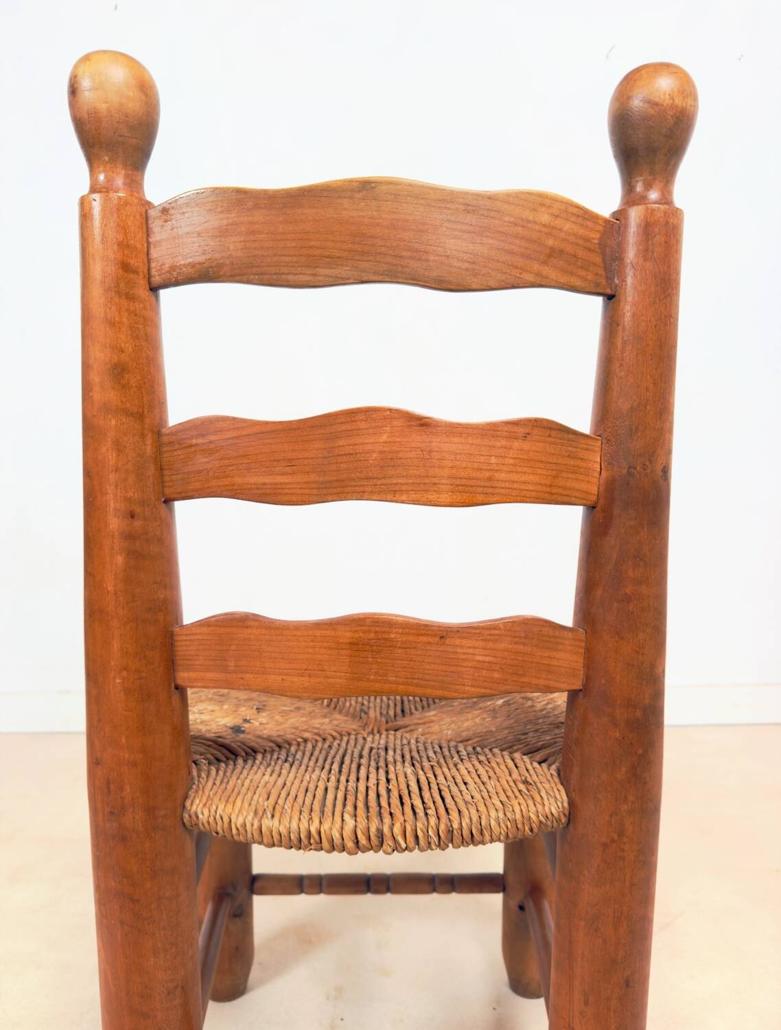 Vintage wooden chair with rush seating
