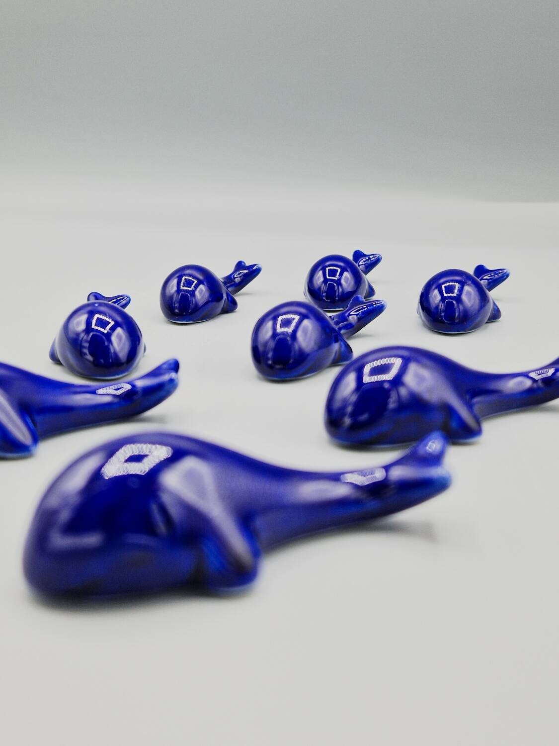 Set of 6 vintage blue porcelain whale knife rests.