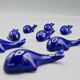 Set of 6 vintage blue porcelain whale knife rests.