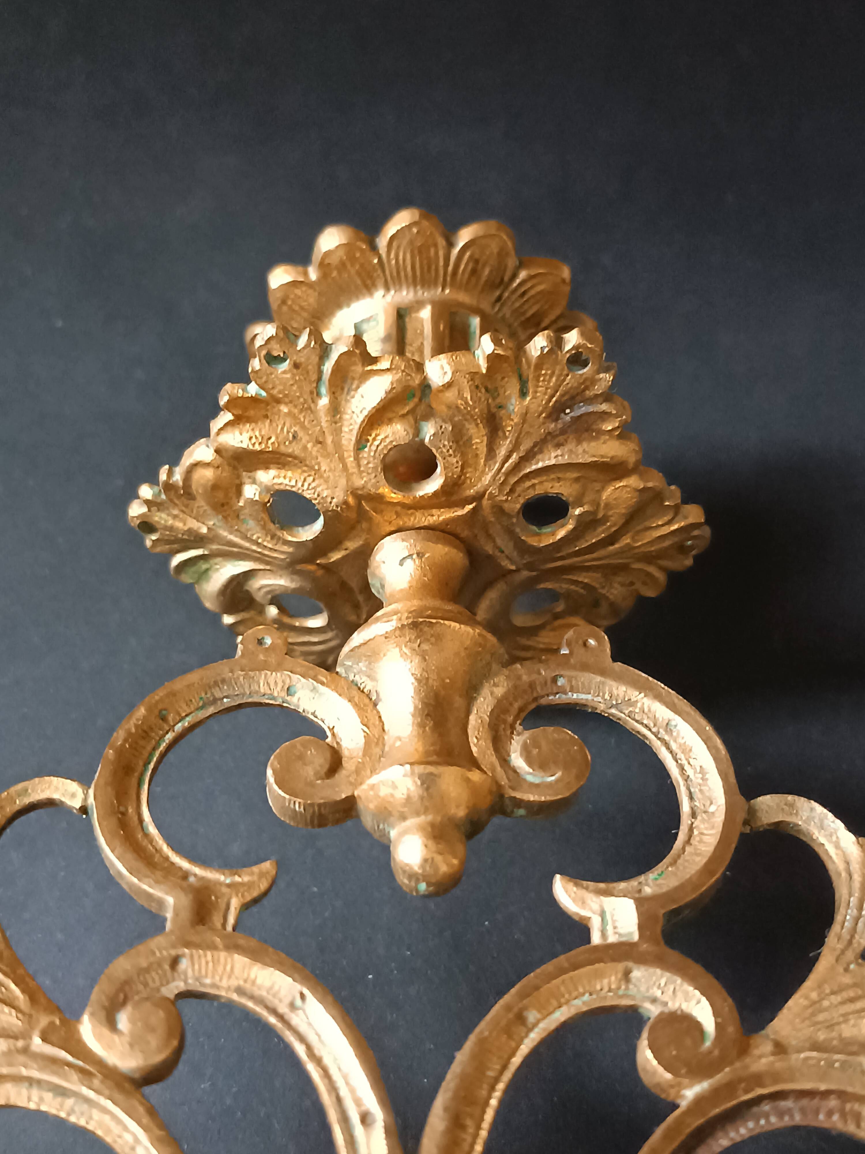 Antique three-light openwork brass church candelabrum.