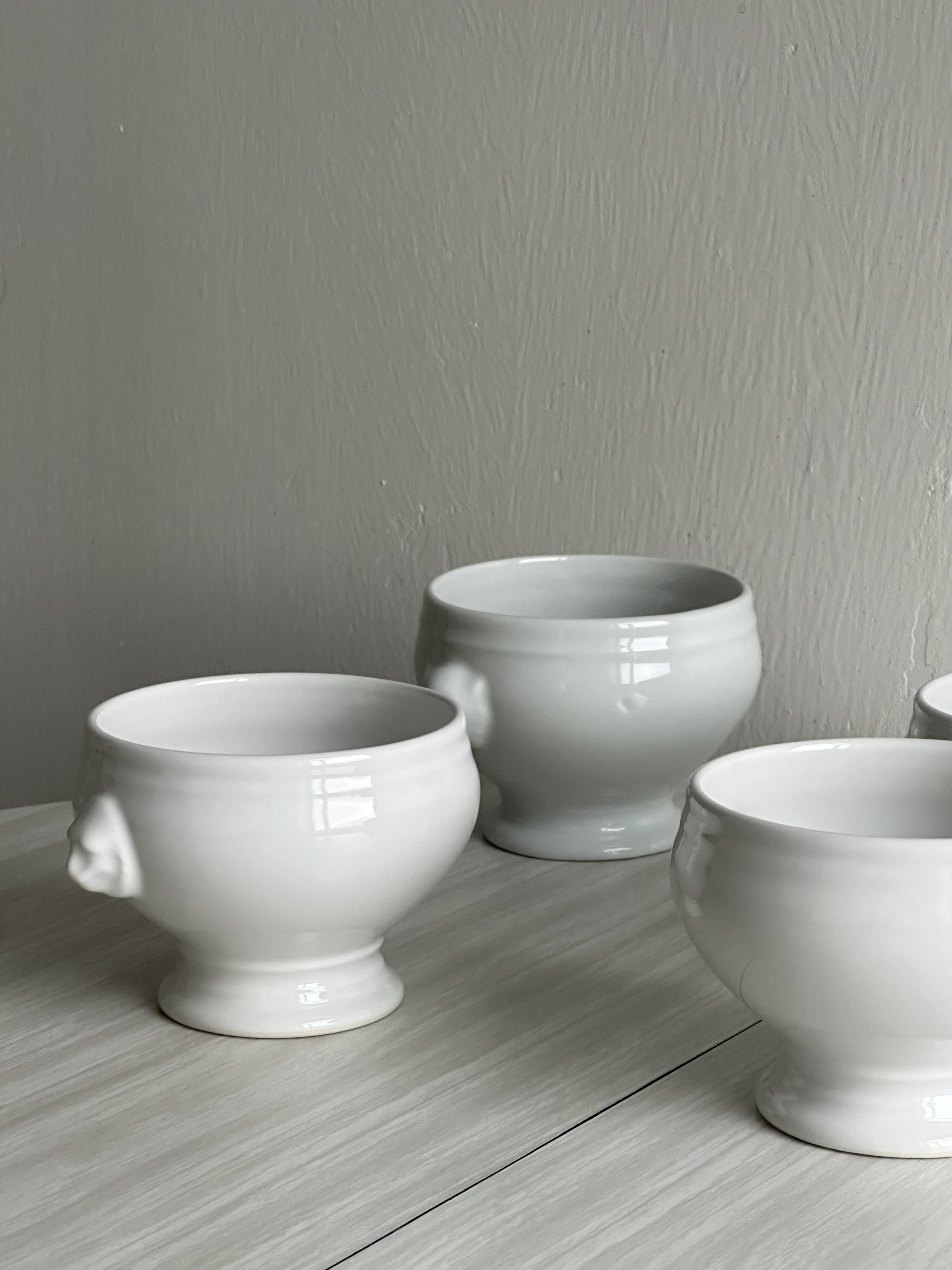4 white porcelain bowls