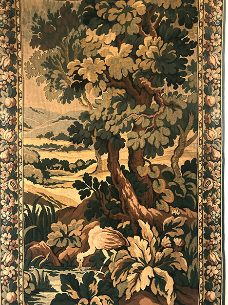 Tapestry decorated with a pink flamingo in a green landscape, woven by hand
