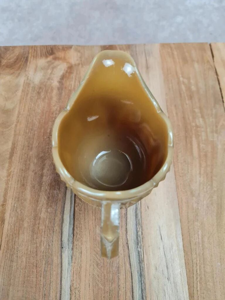 Small antique pressed glass jug in honey colour – moulded decoration