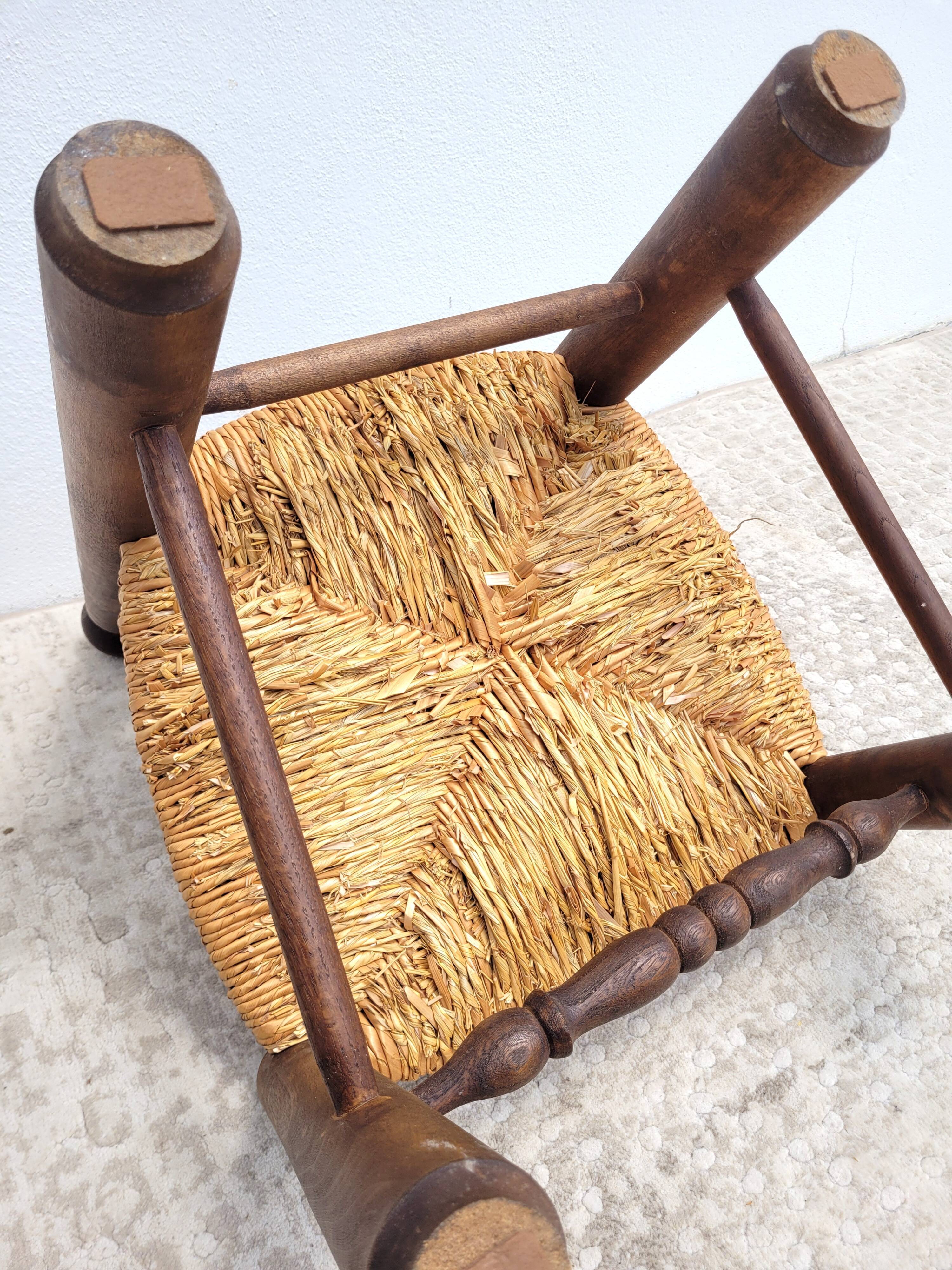 Low chair in turned wood and straw