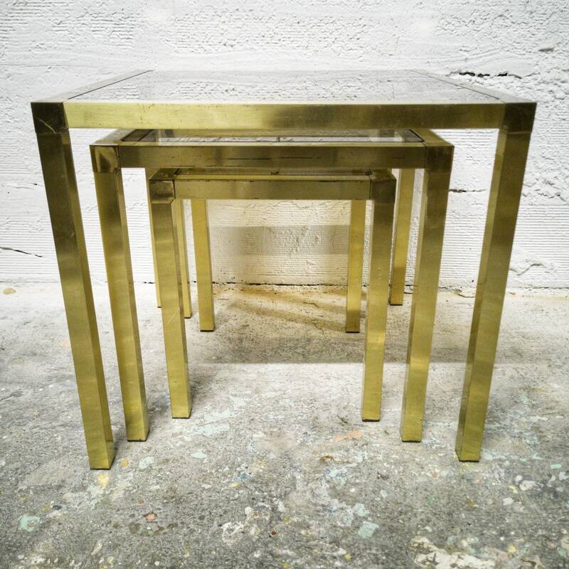 Trio of nesting tables in brass and smoked glass