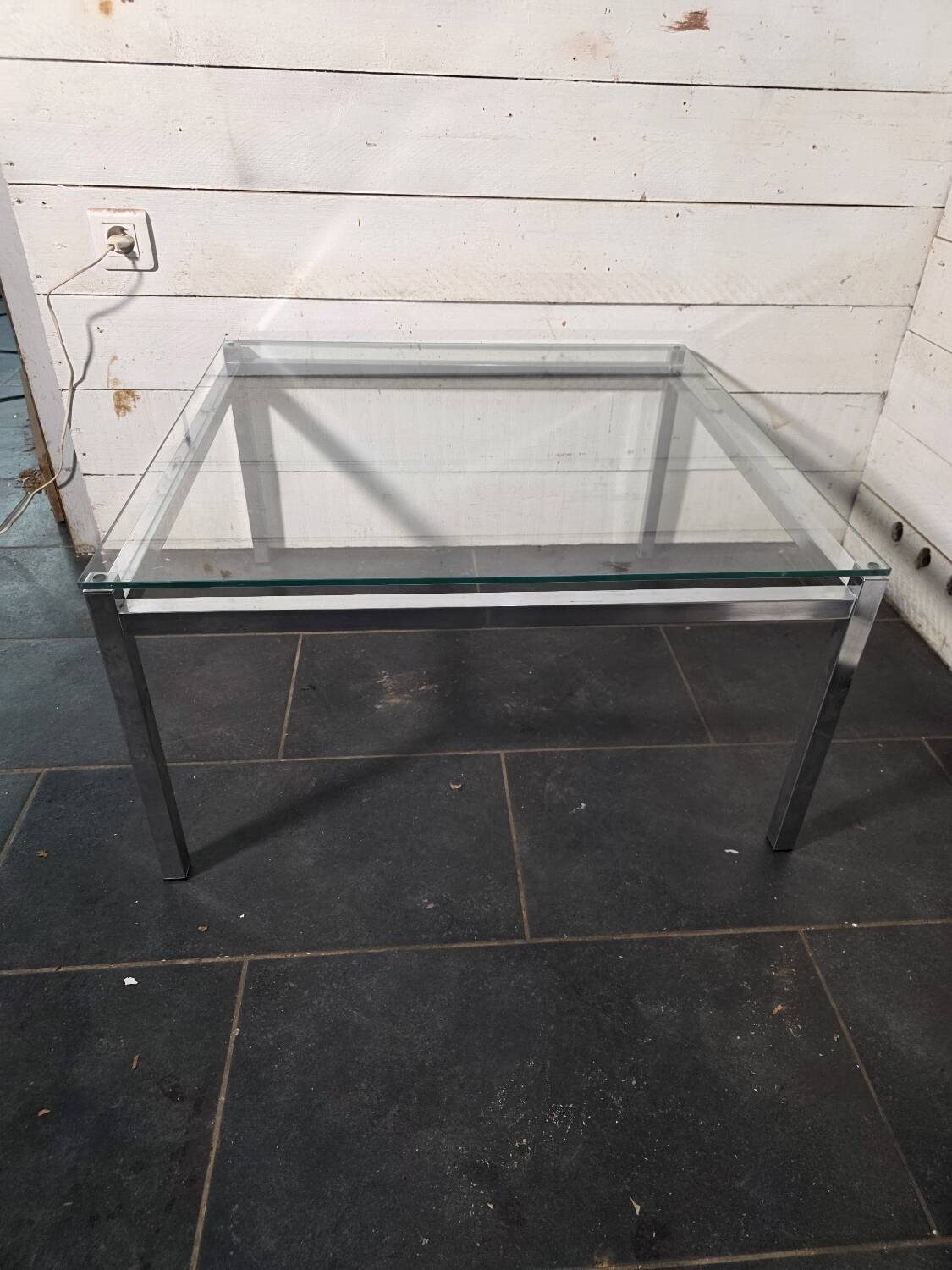Chrome metal coffee table with a glass top from the 1970s.