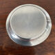 Cup and silver metal saucer