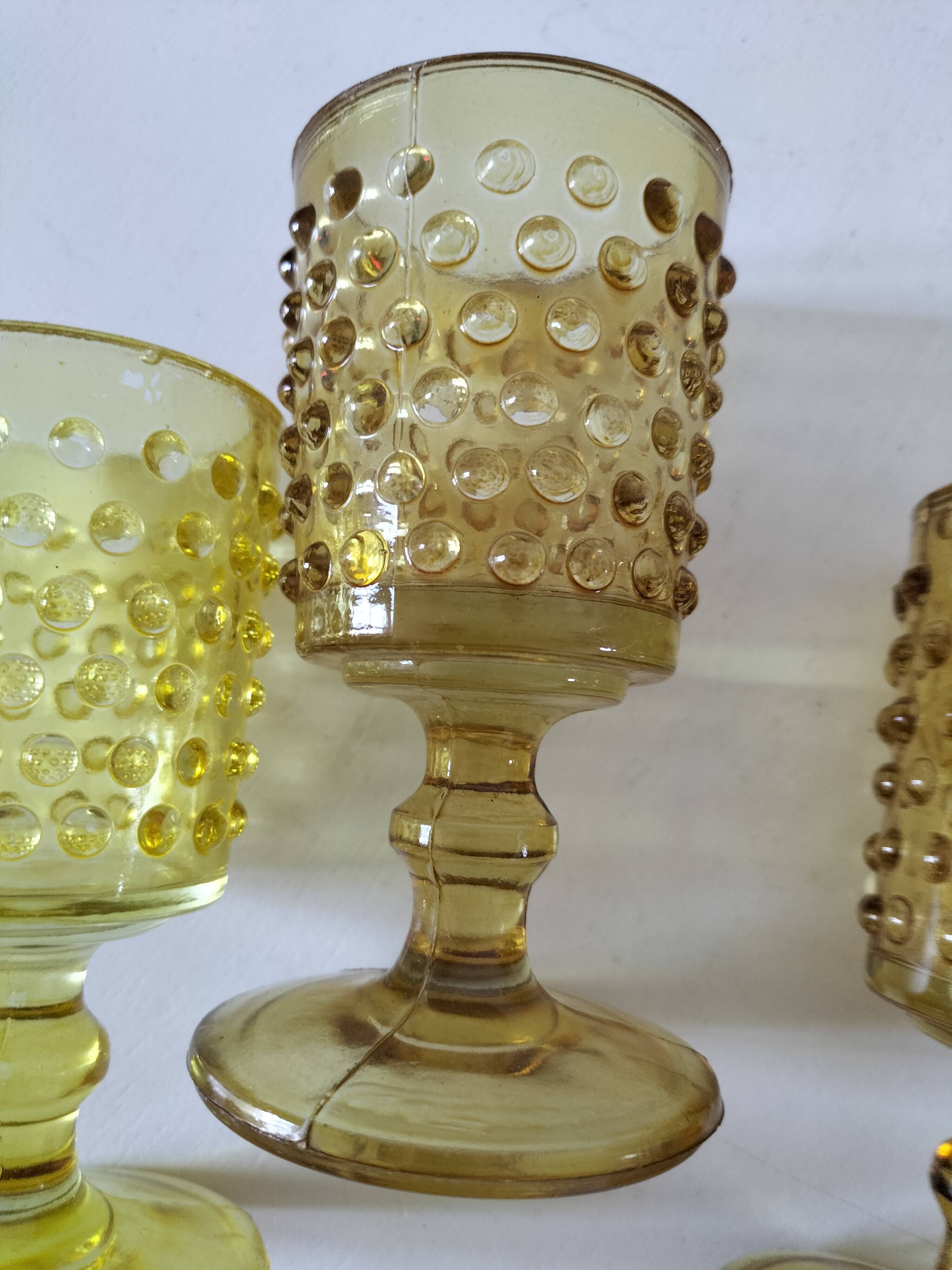 4 vintage stemmed glasses in hobnail glass and smoke colour.