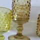 4 vintage stemmed glasses in hobnail glass and smoke colour.