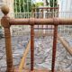 Child's bed or vintage rest bed made of solid cherry wood in a bamboo style.
