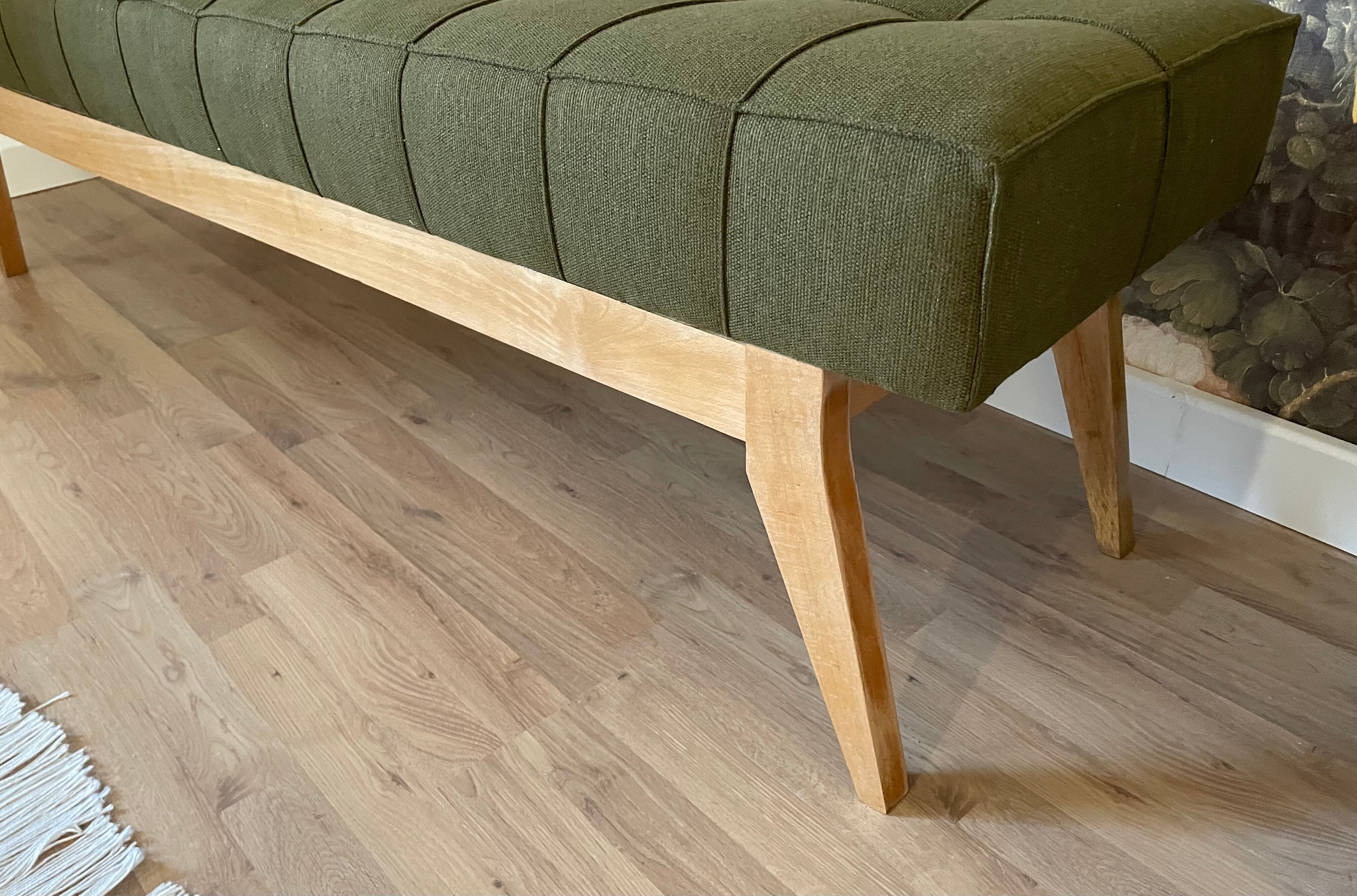 Wooden bench and green fabric