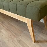 Wooden bench and green fabric