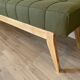 Wooden bench and green fabric