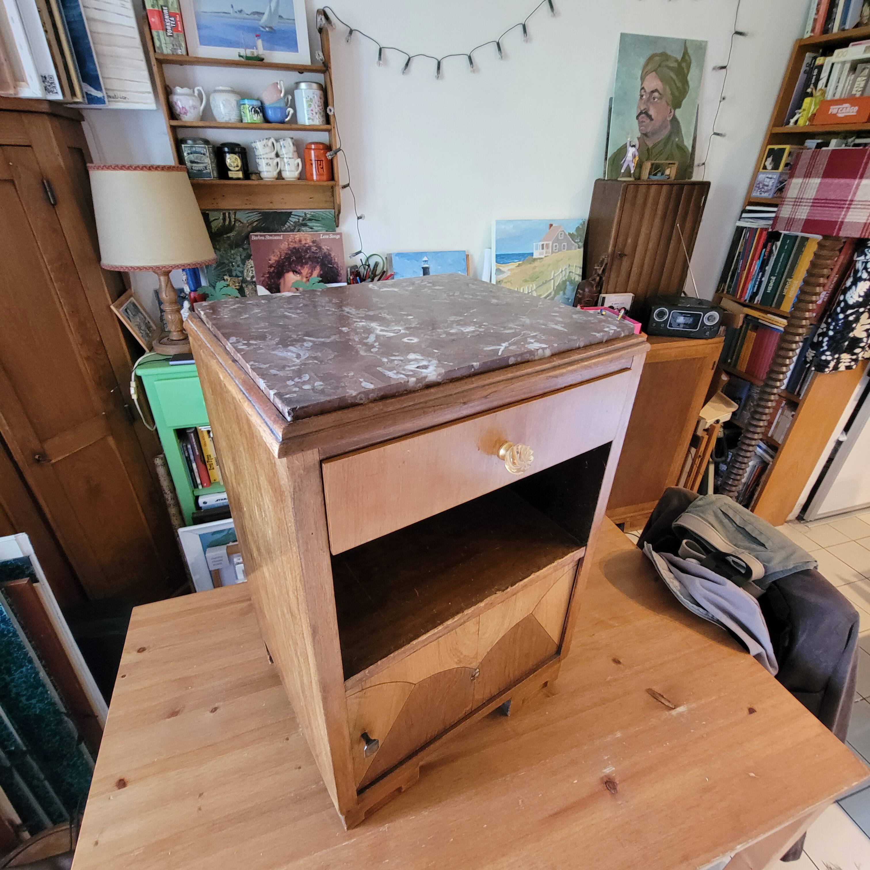 Art Deco bedside table with marble tops.