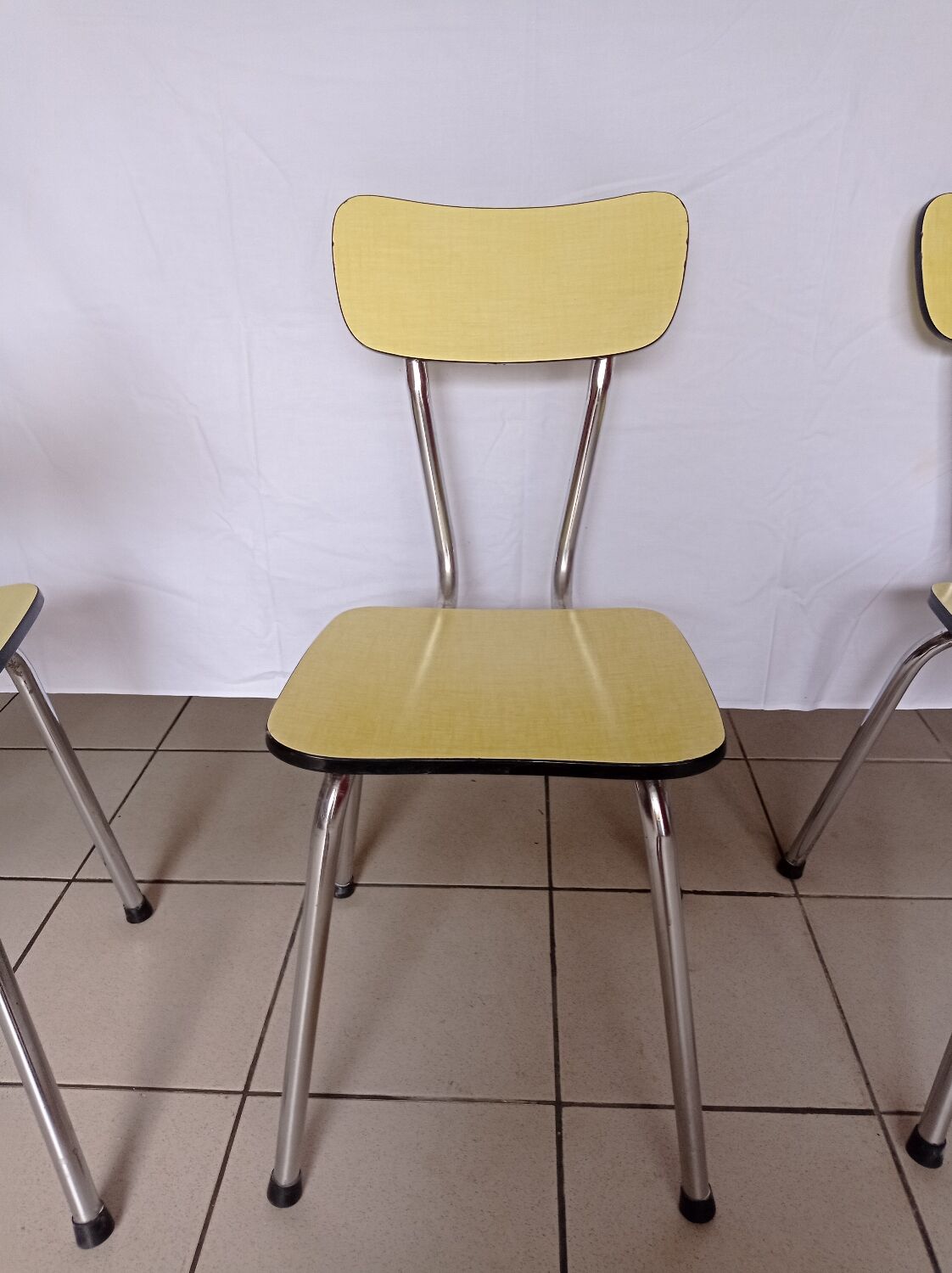 4 yellow Formica chairs
