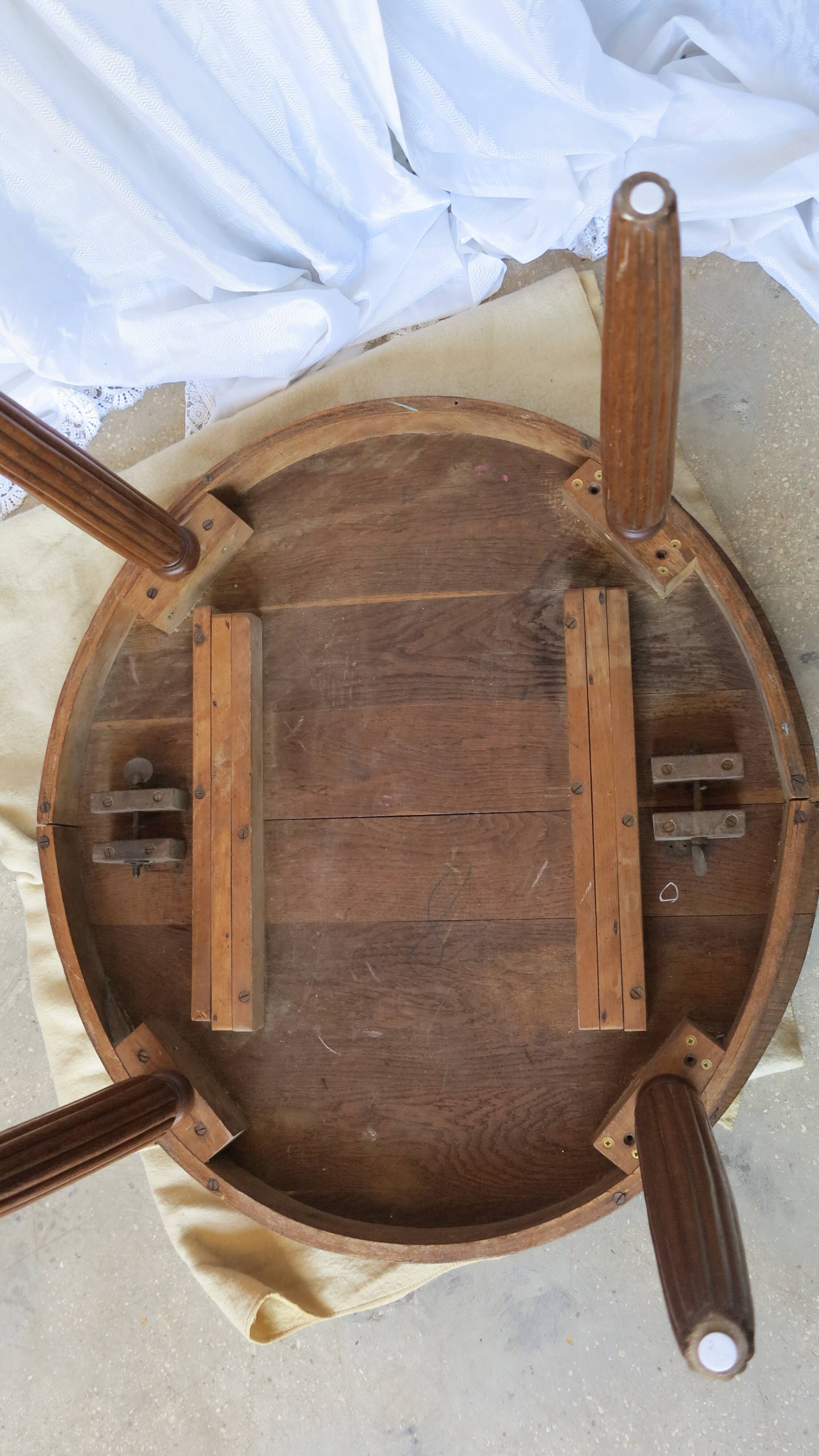1930s oak dining table, slightly oval.