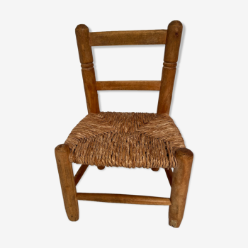 Wooden children's chair with vintage straw seat