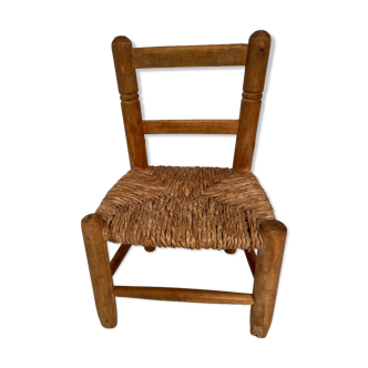 Wooden children's chair with vintage straw seat