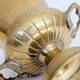 Vintage brass cache-pot on a stand with handles, classic decor.