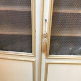 Bookcase 2 painted in ochre and cream mesh doors beginning 20 th