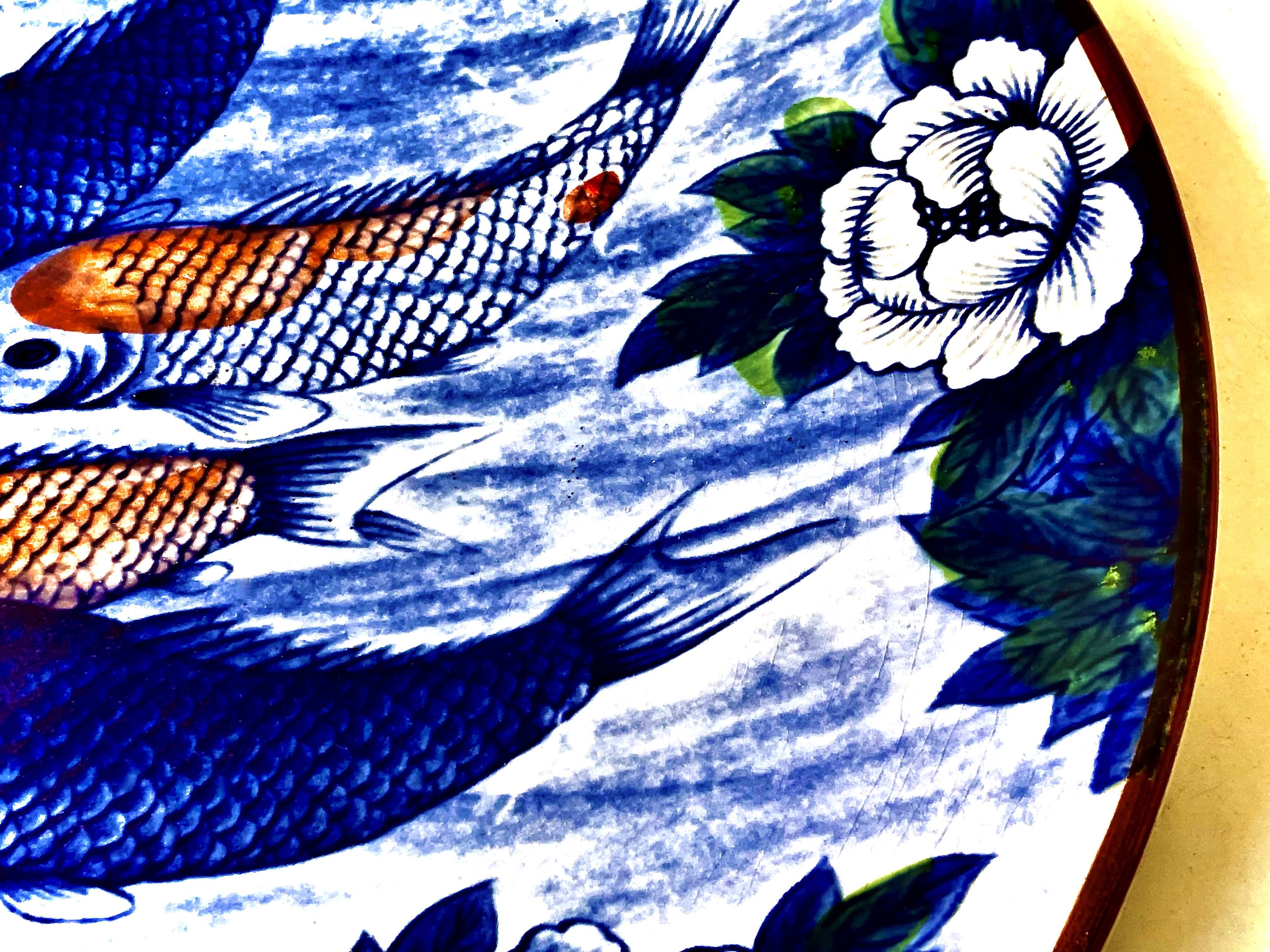 Decorative porcelain plate featuring a koi carp.