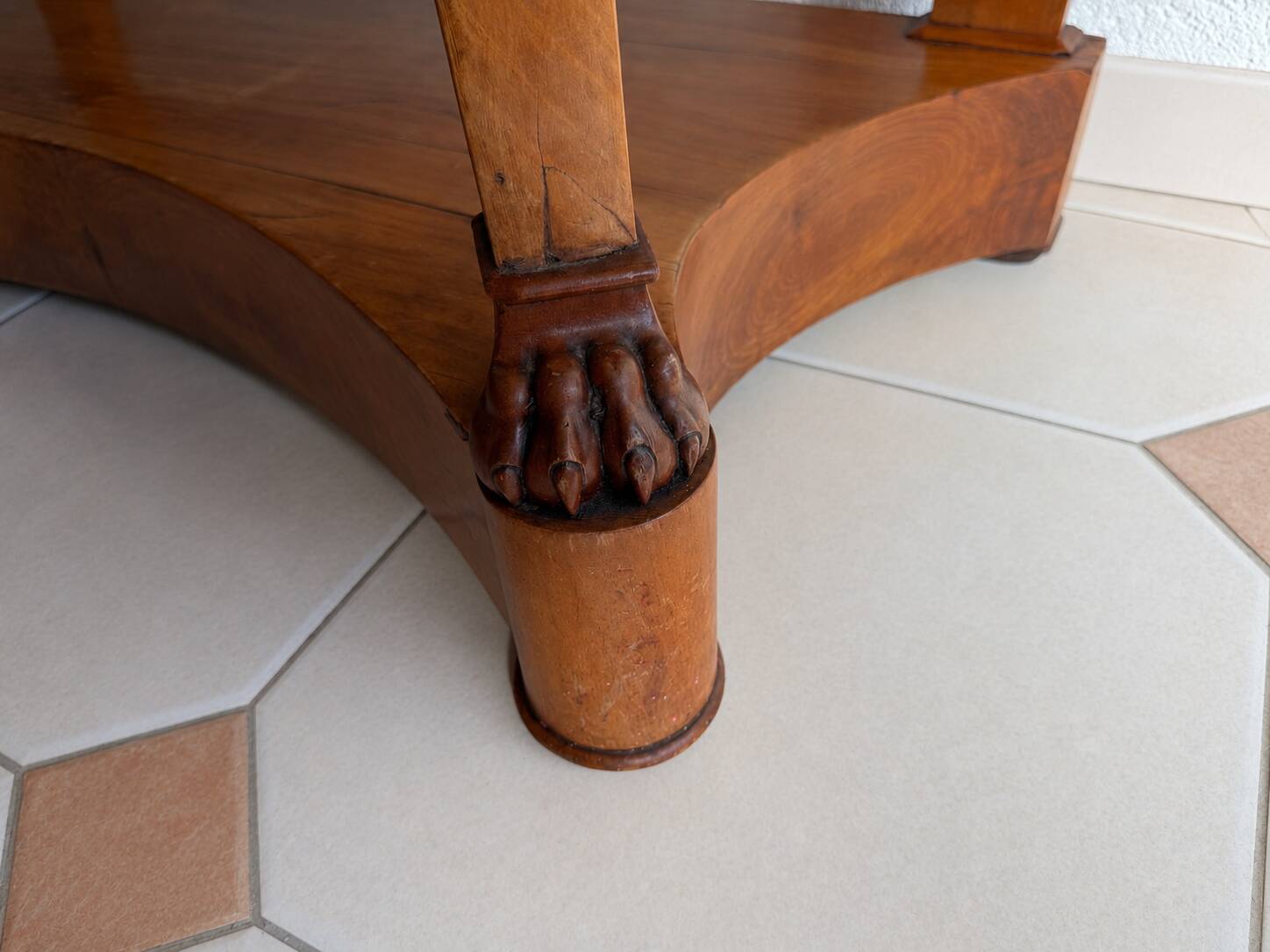 French console from the 19th century in cherry wood and black marble, with claw feet.