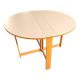 Table à manger pliante scandinave vintage avec rallonges latérales. Le plateau ovale est