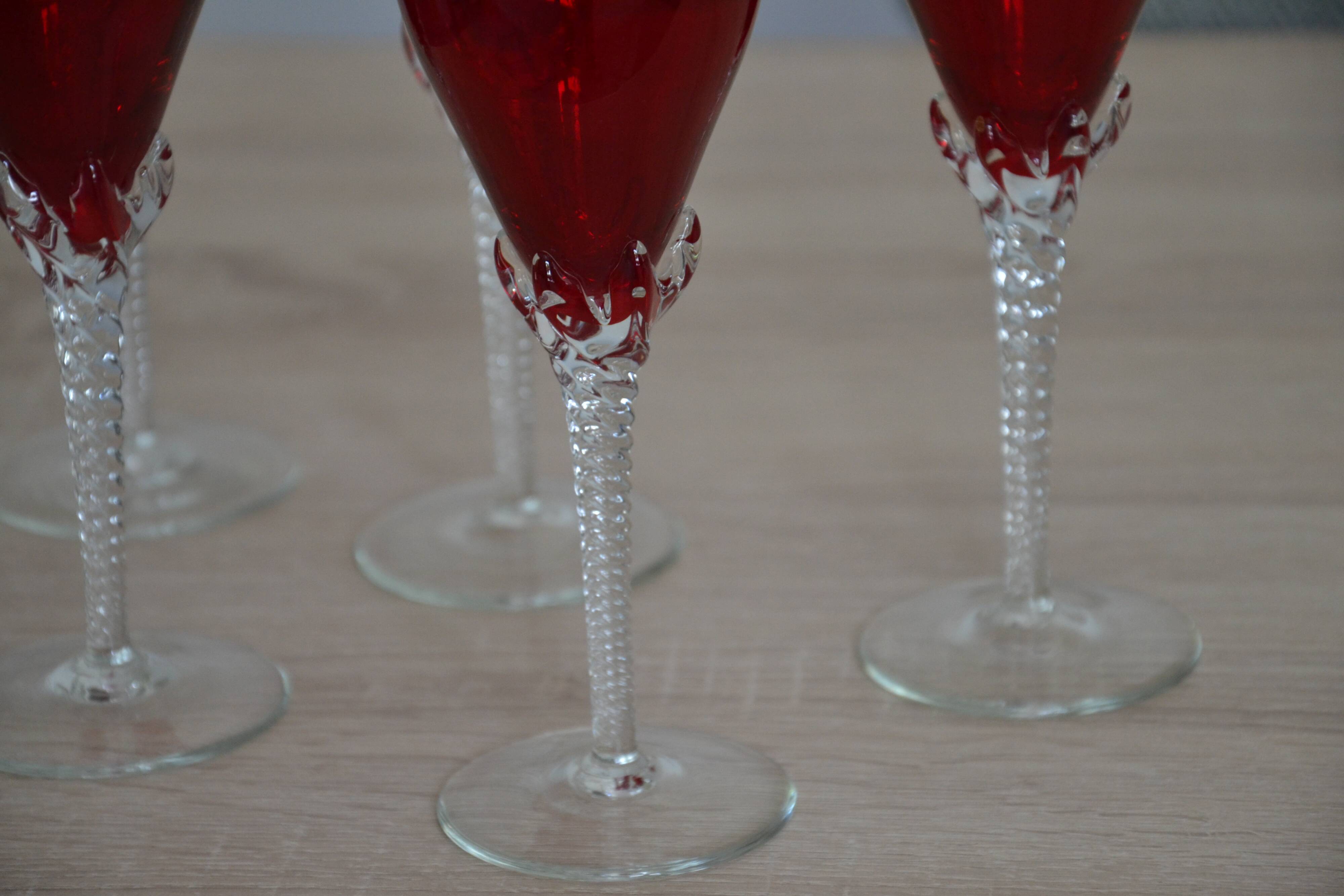 5 red crystal glasses with twisted stems
