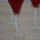 5 red crystal glasses with twisted stems