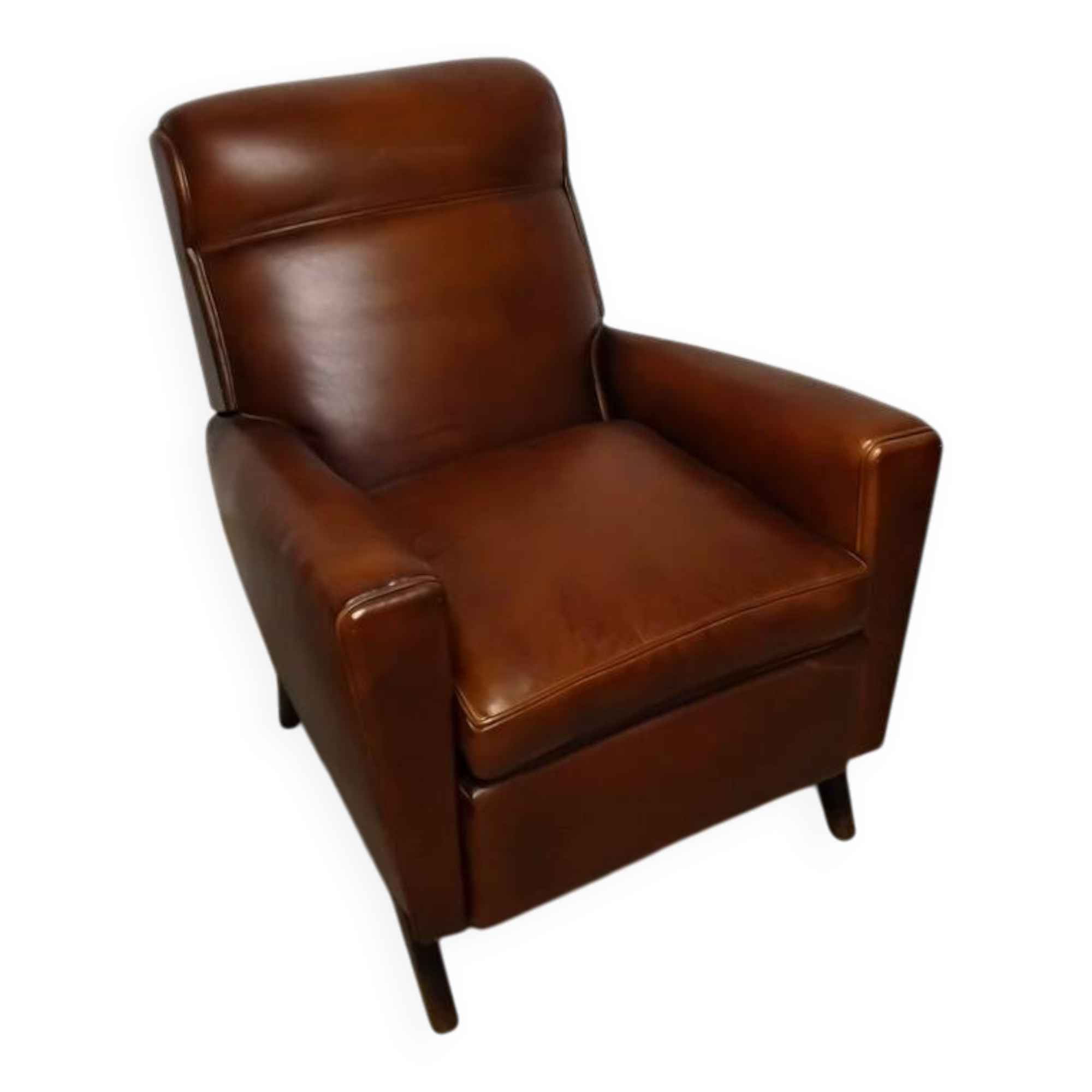 Antique club armchair from the 1950s with compass feet