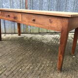 Antique solid cherry farmhouse table with 2 front drawers.