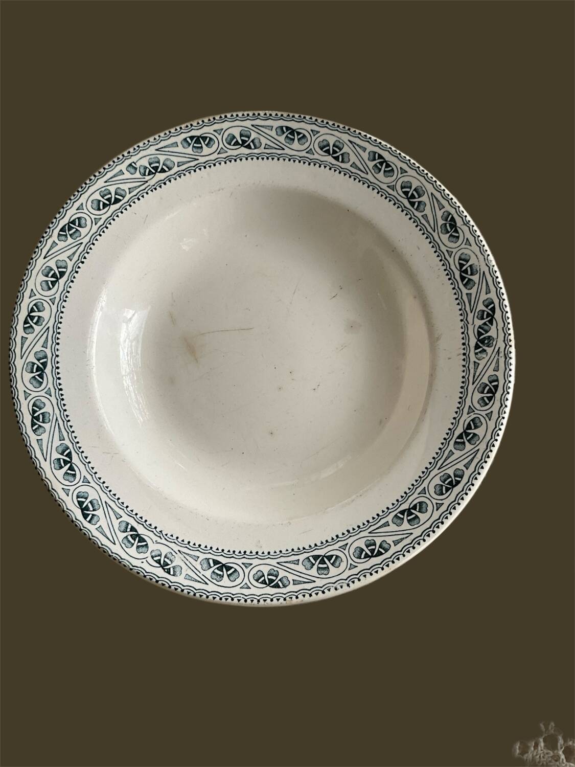 Very old hollow plate made of ironstone.